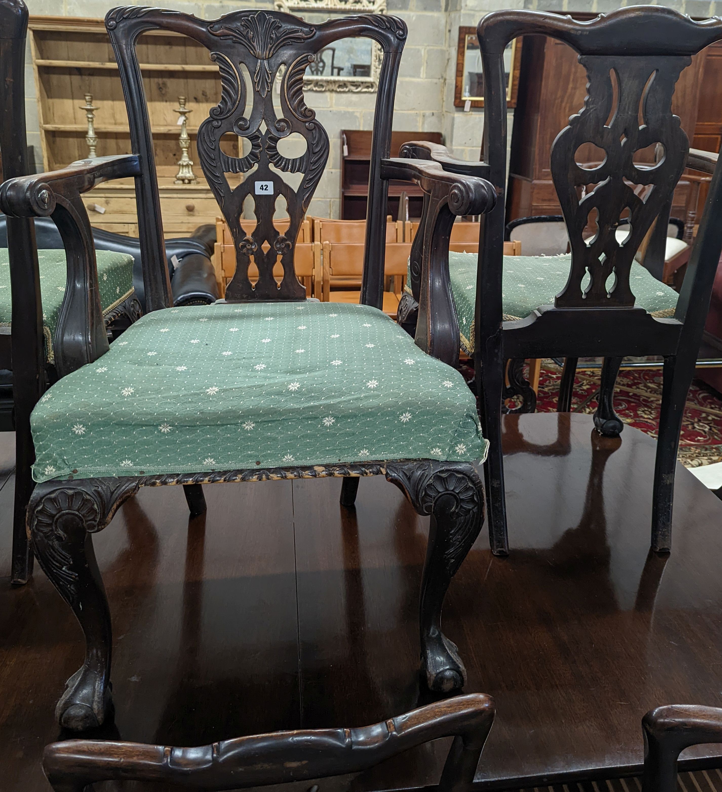 A set of twelve early 20th century Chippendale revival carved mahogany dining chairs including two carvers, width 56cm, height 95cm